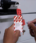 Lockout Tagout Kit For Electrical Safety With Group Lockout Hasps And Padlocks, secured with a hasp and red padlock on a power switch