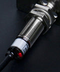 Inductive Proximity Sensor Switch M12 Cylindrical 2mm Sensing, DC 12 To 24V, 3-Wire NPN Normally Open, PR12-2DN, Shielded Flush Mount, CE Certified Industrial Grade Sensor close-up of threaded metal body