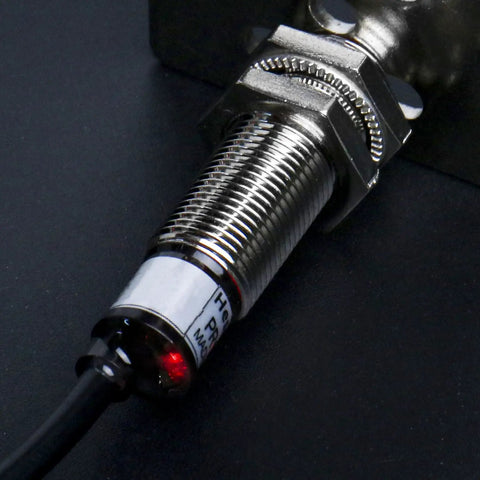 Inductive Proximity Sensor Switch M12 Cylindrical 2mm Sensing, DC 12 To 24V, 3-Wire NPN Normally Open, PR12-2DN, Shielded Flush Mount, CE Certified Industrial Grade Sensor close-up of threaded metal body