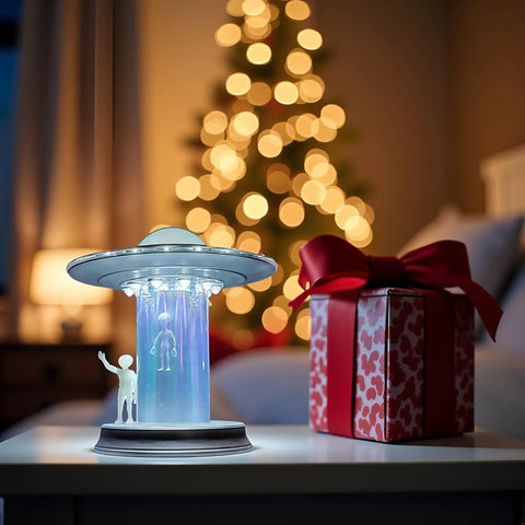 UFO Lamp With Glowing Alien Figures LED Touch Sensor Night Light For Sci Fi Fans next to gift box on bedside table