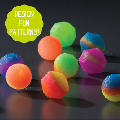 Glow In The Dark Power Balls Diy Stem Kit With 18 Multicolor Crystal Orbs Molds And Instructions Included For Easy Assembly And Bouncy Night Time Fun Tonight. Colorful molded crystal balls on black background.