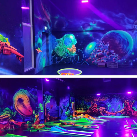 Glow party room with Three Pack 36W Black Light Bars and vivid fluorescent murals, used for Halloween and body paint events.