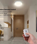 Person using Plug-and-Play Wireless Light Switch And Receiver Kit No In-Wall Wiring Required Remote Control For Ceiling Lights.