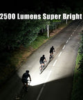 Cyclists riding at night using Beefed Up 2500LM Bike Light For Night Riding With Garmin And GoPro Mounts, illuminating path.