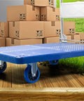 Heavy Duty Foldable Platform Cart With Smooth Glide Swivel Wheels And Self Leveling Balance Frame For Moving Couches Mattresses Or Toolbox Gear Haul Big Loads Like A Pro on wooden surface, surrounded by boxes.