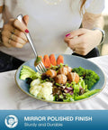 Person using a fork from a 20 Piece Silverware Set For Four Built From Food Grade Stainless Steel Flatware with a salad