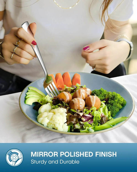Person using a fork from a 20 Piece Silverware Set For Four Built From Food Grade Stainless Steel Flatware with a salad
