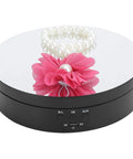 Stunning Multi Wits Electric Rotating Display Stand With Three Speed Settings And 360 Degree Turntable showcasing jewelry and cosmetics.