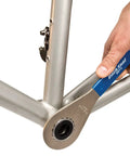 Close-up of BBT-9 Bottom Bracket Tool Pro Grade for Shimano Hollowtech II in use on a bicycle frame, installing bottom bracket.