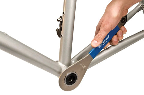 Close-up of BBT-9 Bottom Bracket Tool Pro Grade for Shimano Hollowtech II in use on a bicycle frame, installing bottom bracket.