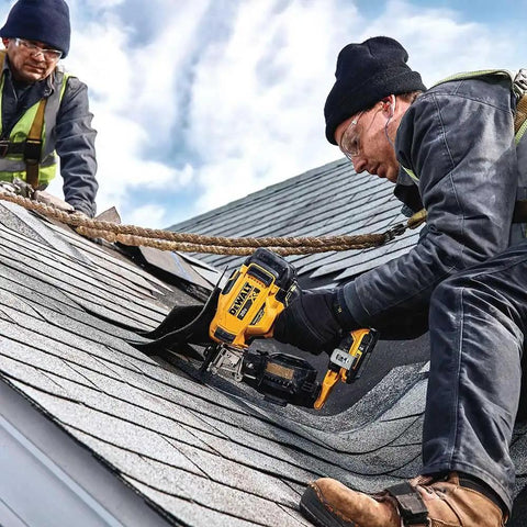 Worker using 20V Max Brushless 15 Degree Cordless Roofing Nailer With Tool Free Nail Tray Battery Powered Yellow And Black on roof