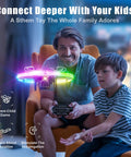 Father and son playing with Mini RC Drone Quadcopter for kids with 360 degree flip and neon LED lights indoors.