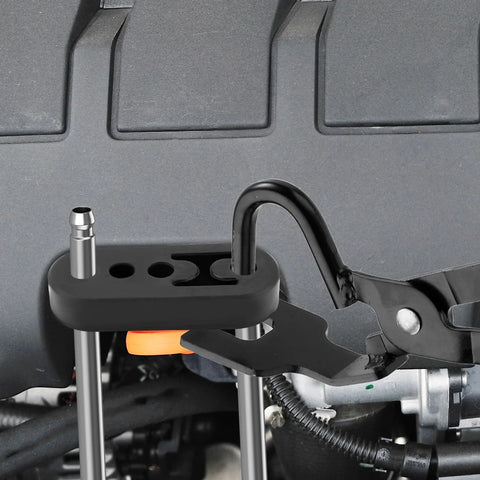 Close-up of Exhaust Hanger Removal Tool and 4 Hole Rubber Hangers Kit for Cars Trucks, showing tool in use with engine components.
