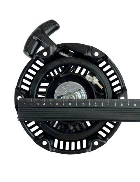 Top view of black Recoil Pull Start 590607 797276 for Briggs & Stratton CR950 CR750 Engine with rope and ruler measurement