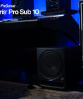 10 Inch Front Firing Studio Subwoofer, Active Sub With Glass Composite Driver in a home studio setup with blue lighting