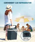 Woman holding a Portable 27 Quart Electric Cooler And Warmer For Car Or Home With Handle 12V/24V DC And 100-240V AC at the beach.