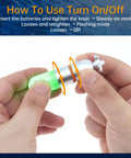 Hands adjusting Two Pack Scuba Dive Strobe Signal Lights Mini Tank Lit Night Dive Markers Underwater LED Flashing Safety Beacons 150M Waterproof Dive Lights For Tanks Or BCDs Long Battery Life With AAA Batteries Green
