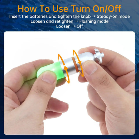 Hands adjusting Two Pack Scuba Dive Strobe Signal Lights Mini Tank Lit Night Dive Markers Underwater LED Flashing Safety Beacons 150M Waterproof Dive Lights For Tanks Or BCDs Long Battery Life With AAA Batteries Green