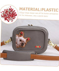 Gray faux-leather crossbody bag with a dog-face patch and red rhinestones, gold hardware.