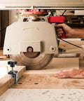 Set Of 4 Heavy Duty C Clamps For Woodworking And Metalworking in use on a workshop table with a cutting saw, black aluminum alloy.