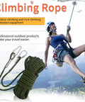 Person rappelling with rugged 10 millimeter climbing rope with two steel hooks for outdoor rescue, army green, polyester cord for cliffs.