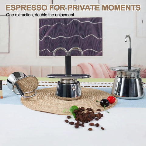 Heavy Duty 2 Cup Dual Pipe Moka Pot Crafted From Thickened 304 Stainless Steel Using Fully Uncoated Inner Walls For Rock Solid Extraction That Totally Slaps When You Kickstart Your Daily Grind on a table with coffee beans.