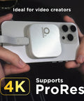 Person holding an iPhone 15 Pro Max with a Magnetic External SSD 1TB For On The Go Storage With MagSafe Portable USB 3.2 Gen 2x2 Drive.