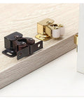 Stainless Steel Cabinet Latches 18 Pcs Dual Wheel Spring Catches Self Locking Hardware For Cupboard, Drawer And Wardrobe Door Fix Fitting, showing black and bronze latches on a wooden surface.
