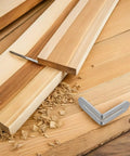 Stainless steel L shape shelf bracket with adjustable slot design for wood shelves and tables next to wood boards and sawdust