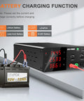 High Power Bench Power Supply 30V 30A 900W with encoder knob and output switch charging a LiFePO4 12V battery in lab setting
