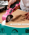 Heavy Duty 4V Electric Cardboard Cutter With Bright Led Light, Ergonomic Handle For Easy Shipping And Packing Boxes, Fast Automatic Cutting Tool For Home Office Storage And Moving Day Projects in use cutting cardboard.