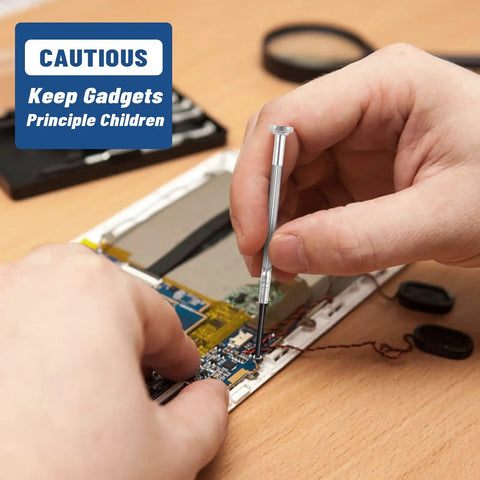 Using the Six Piece Mini Precision Screwdriver Set With Flathead And Phillips Bits for electronics repairs.