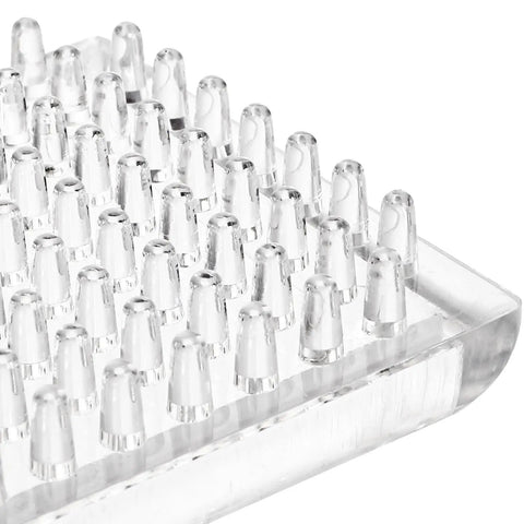 Close-up of clear plastic square spiked caster cup with studded base, part of 24 Pack Spiked Caster Cups For Furniture Protectors Clear Plastic Round And Square Cups With Studded Base Built Tough And Easy Glide On Carpet For Chairs Tables Sofas And Beds