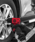 Mechanic using CP7741 Half Inch Air Impact Wrench With Twin Hammer Power For Auto Repair And Shop to tighten wheel bolts.