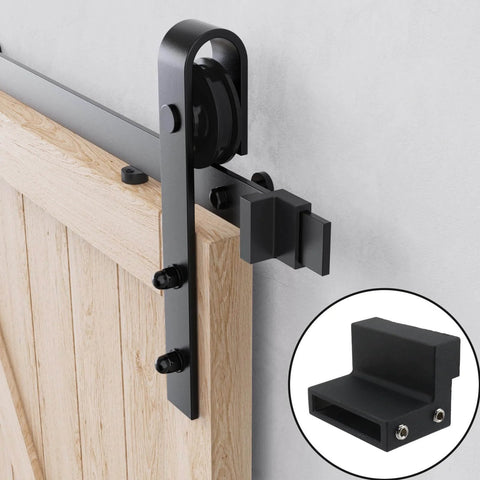 Black Carbon Steel Sliding Barn Door Roller Stopper Hardware Set With Wrench, shown installed on a wooden door track.