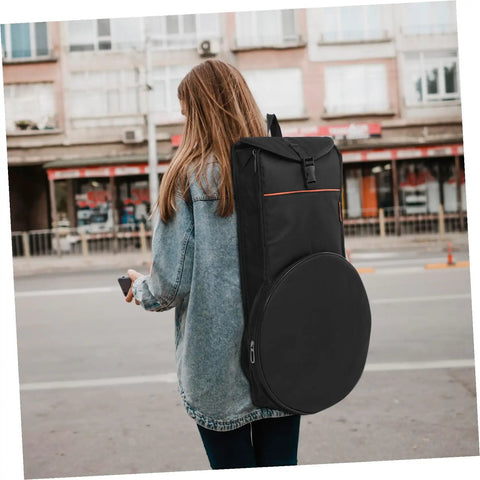 Lock Down Your Percussion Rig With This Straight Up Tough Oxford Fabric Dumb Drum Storage Bag And Snare Accessory Pouch Built Flat Out Durable For Gig Loads And Weekend Campout Shreds, shown being carried.