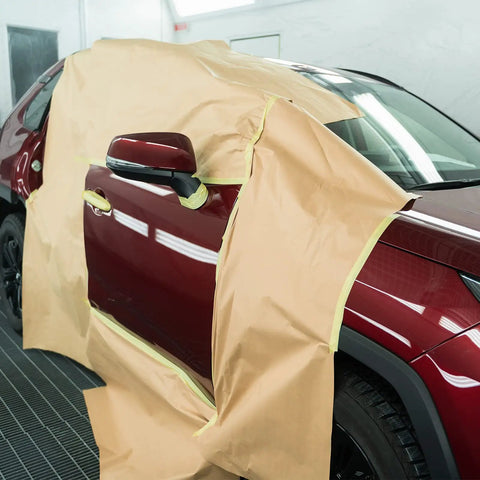 Red car door covered with paper using eight roll masking tape and paper set with six paper rolls and two yellow painter tapes