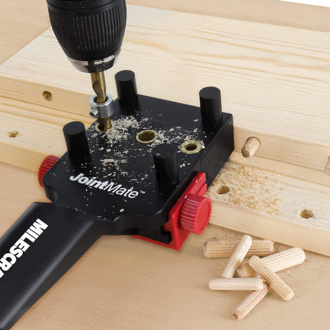 Self Centering Dowel Jig Kit for Woodworking shown drilling precise dowel holes in wood with metal bushings and dowels visible.