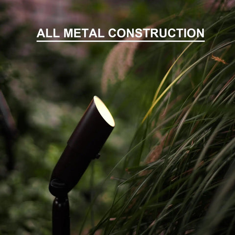 Low Voltage Landscape Spotlight Kit 8 Pack, 20W Halogen Outdoor Lights, metal stake, illuminating garden foliage.