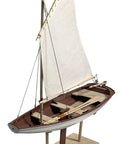 Norwegian Sailing Pram Model Kit 1:12 Scale For Adults, DIY Woodcraft Project, showing assembled sailing pram on stand