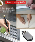 Hands using sharp cutting knife to score glass, with close-up view of blade and handle.