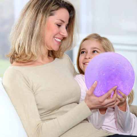 Mother and daughter holding Lit Moon Lamp 3D Printed LED Night Light With 16 Color RGB Modes Remote And Touch Control Adjustable Brightness USB Recharge Realistic 6 Inch.