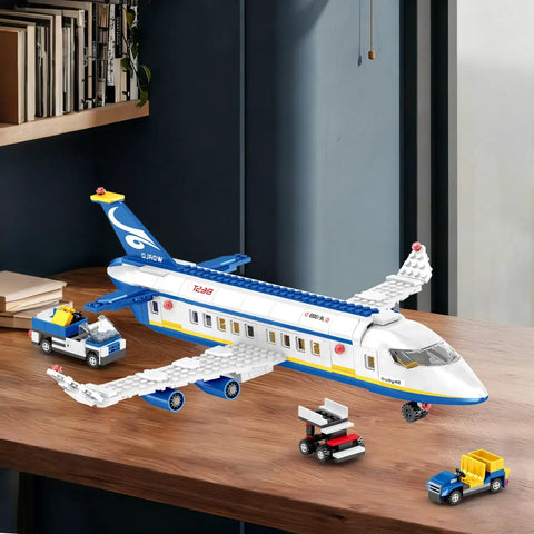 6 In 1 Airport Passenger Plane Building Set With 510 Pieces for STEM on table showing plane, baggage truck, and shuttle bus.