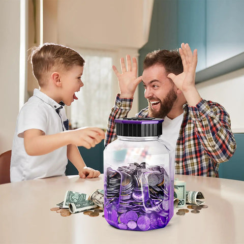 Father and son excitedly using X Large Piggy Bank For Adults And Kids With Digital Coin Counter And LCD Display 2.4L Capacity Holds 2000 Plus US Coins Great Money Counting Jar That Tallies Every Cent And Shows Total Amount In Gradient Purple on table.