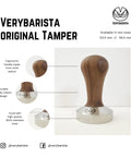 53.35mm Espresso Tamper With Wood Handle And Food Safe Stainless Steel Base Precision Fit For 54mm Espresso Baskets Ideal For Home Baristas Comfortable Grip Italian Made on display with walnut handle and stainless steel base, highlighting ergonomic design and material details.