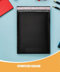 50 Pack Black PE Bubble Mailers With Self Seal Closure, Padded Shipping Envelopes For Ecommerce shown on a desk