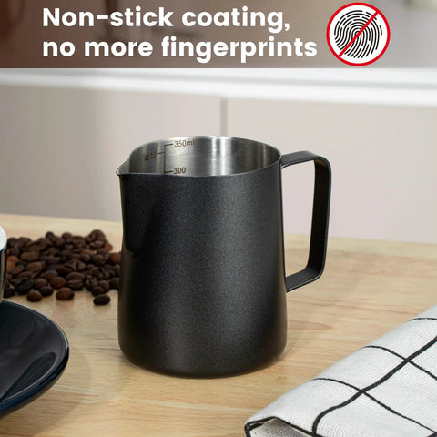 12Oz Stainless Steel Milk Frothing Pitcher With V Shaped Spout And Teflon Coating next to coffee beans