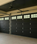 Hella Tough Heavy Duty Reflective Garage Door Insulation Kit Single Car Thermal Barrier R8 Value installed in garage with black doors.