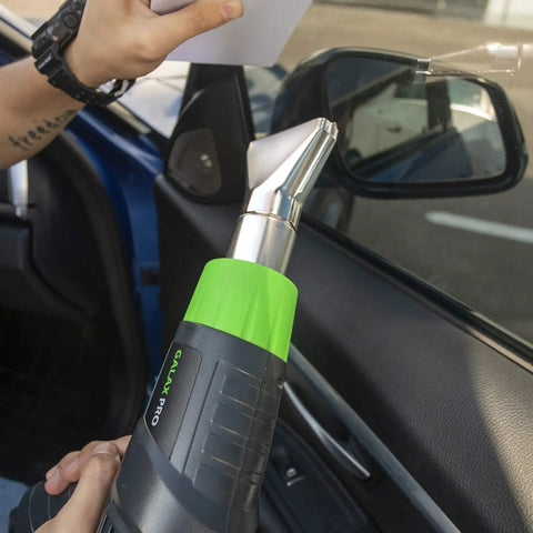 Person using Heavy Duty 12 Point 5 Amp Heat Gun Kit With Dual Temperature Settings 300C And 500C Includes Four Nozzles for car repair