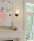 Phoebe 8 Inch Modern Wall Sconce With Frosted Seeded Glass Cylinder Shade In Chrome Finish Industrial Style Bathroom Light For Powder Room Mid Century Modern Vibe With Slick Cylinder Glass Fixture.